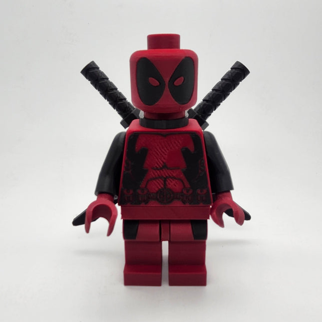 Oversized Deadpool inspired red and black brick-style collectible with twin swords