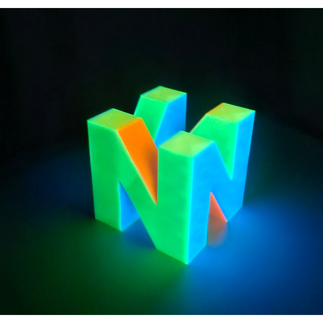 N64 inspired multicolor logo glowing brightly in the dark