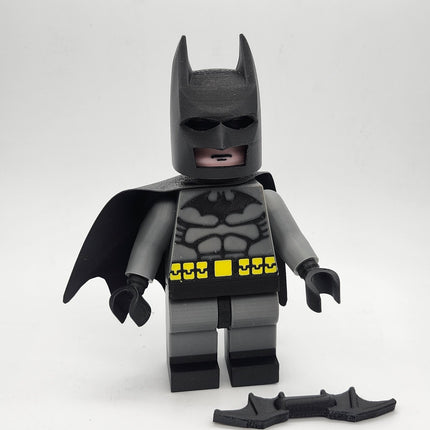 Oversized Batman-inspired brick-style display figure with removable cowl, cape and batarang