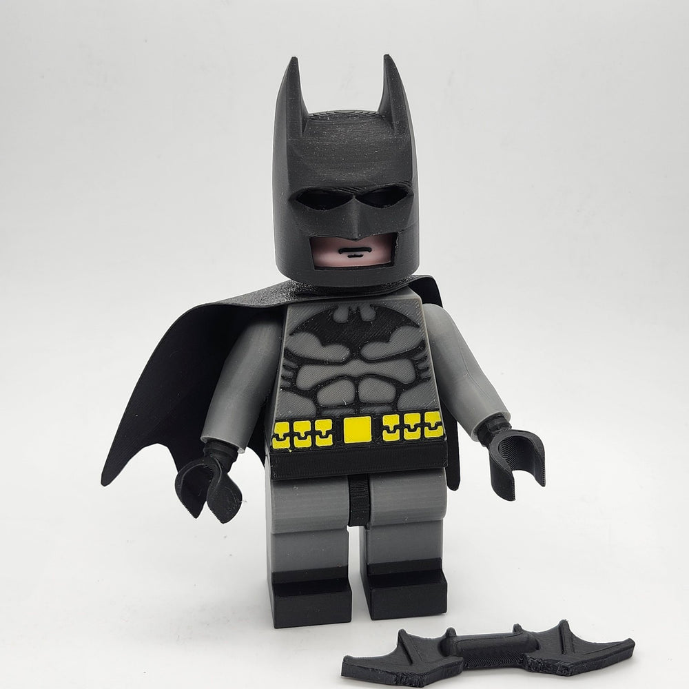 Oversized Batman-inspired brick-style display figure with removable cowl, cape and batarang