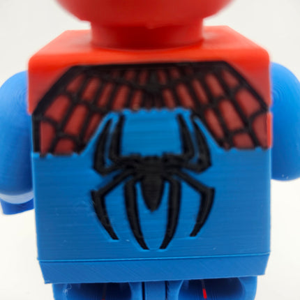 Close-up rear spider emblem detail on oversized brick-style collectible
