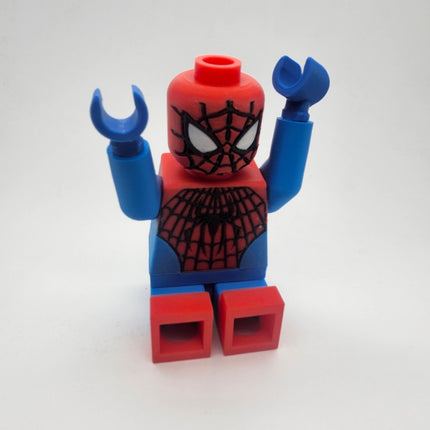 Spider-Man inspired oversized brick figure seated with poseable arms raised