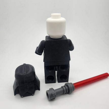 Rear view of oversized Vader-inspired brick figure with removable helmet and saber accessory