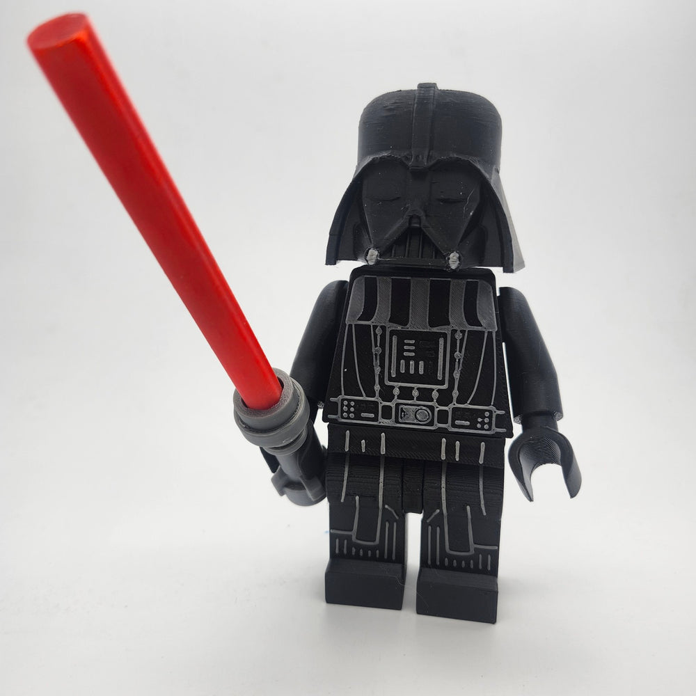 Oversized Darth Vader inspired brick-style collectible with removable helmet and red saber accessory