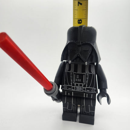 Darth Vader inspired oversized brick figure shown with measuring tape at approximately 6 inches tall