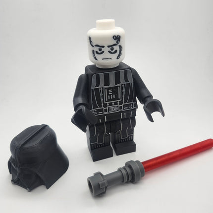 Oversized Darth Vader inspired brick figure displayed without helmet beside red saber accessory